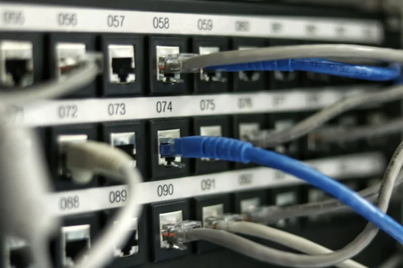 Patch panel with blue and grey Ethernet cables